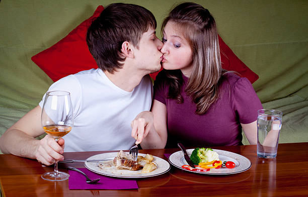 Young couple having a dinner stock photo