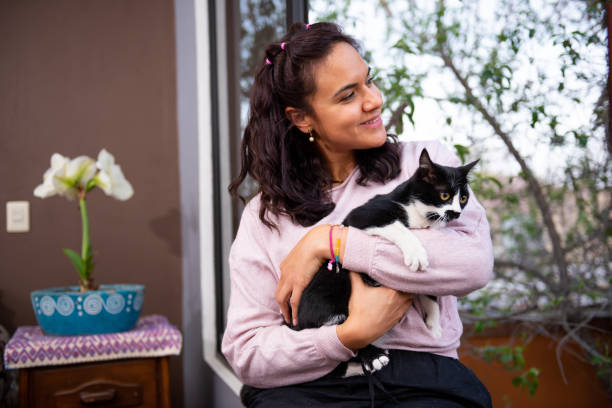 istock Woman having time with her cat in home 1470363338