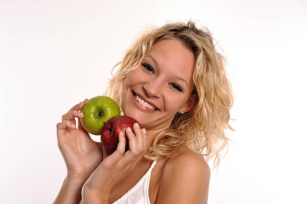 Pretty Girl with two fresh apples stock photo