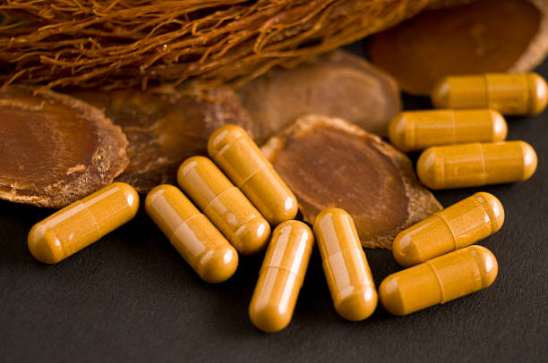 istock Dry Ginseng Slices, capsules and roots 147037234