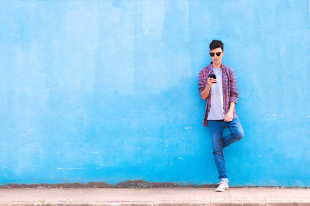 istock Man using smartphone on the street 1470375858