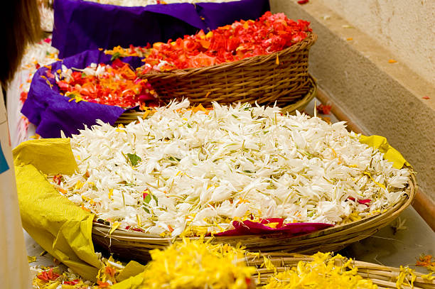 Colourful flower petals in baskets for traditional Hindu celebration in Mumbai India
