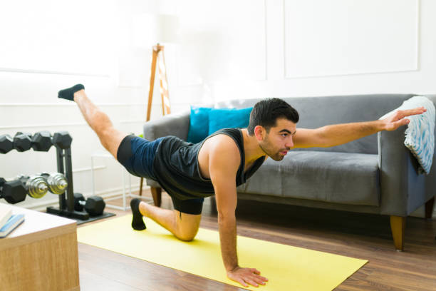 istock Sporty latin man working out with a home workout 1470377041