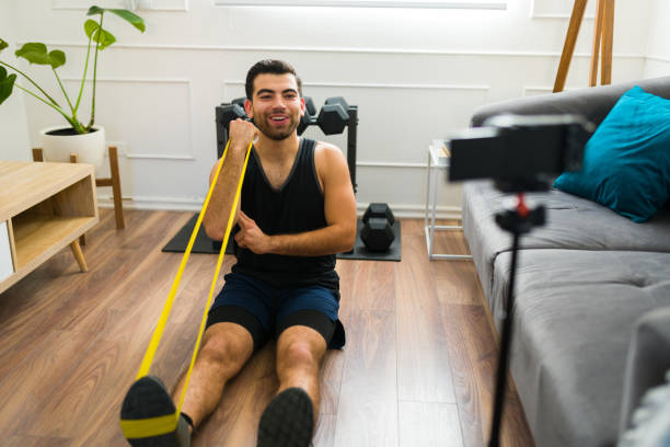 istock Happy fit man training and filming exercise videos 1470377316