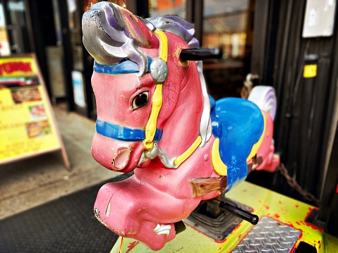 Showa retro play equipment in a Japanese park - cute horse seesaw photo