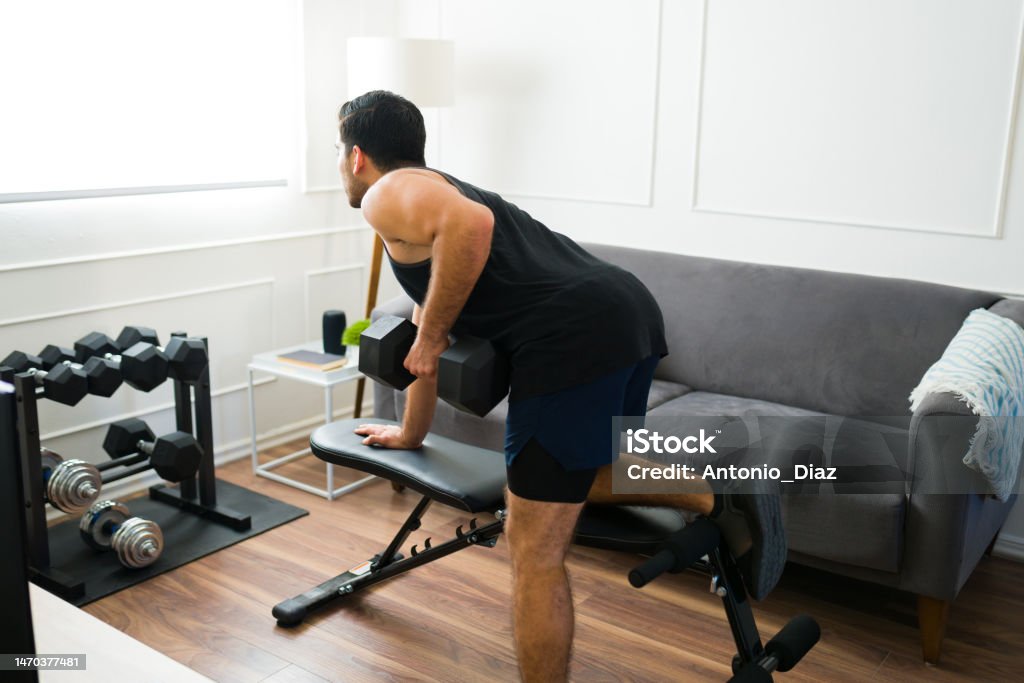 Man Straining As He Rows Fit Active Man Doing Bench Rows Exercises Stock Photo - Download Image ...