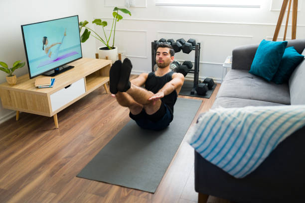 istock Strong latin man doing sit ups exercises during his cardio workout 1470377517