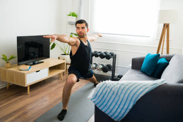 istock Hispanic man practicing a yoga workout at home 1470377567