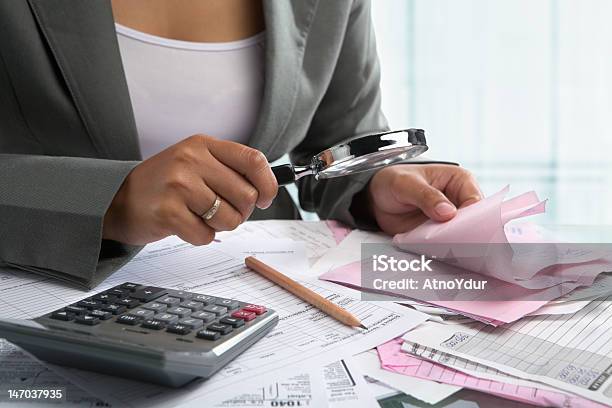 Woman Checking Bills Stock Photo - Download Image Now - Document, Financial Bill, Magnifying Glass