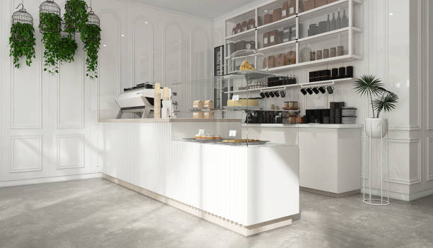 istock Modern, luxury design cafe, corrugated counter with espresso machine, cake display fridge, cabinet, shelf and plants in sunlight from window on white wainscot wall and cement floor 1470383252