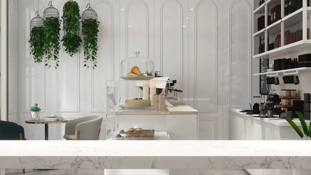 istock Empty white marble counter, tabletop in modern, luxury design cafe with white counter, espresso machine, cake display refrigerator, cabinet, cupboard shelf, green plant in sunlight on wainscot wall 1470383454