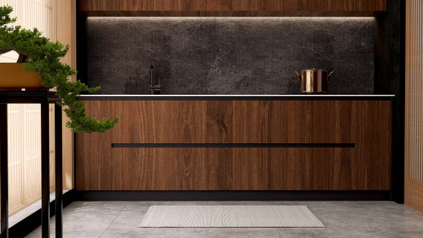 istock Luxury, modern beautiful wood grain wooden counter, black granite splashback, cupboard, gray tile floor in Asian style kitchen and bonsai tree in sunlight 1470383618
