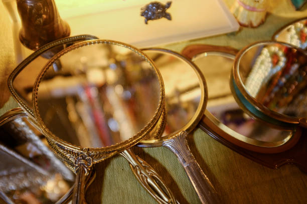 Vintage hand mirrors on a table at a flea market