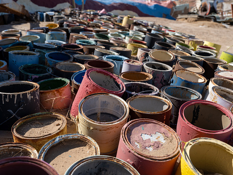 Group of colorful decaying paint cans