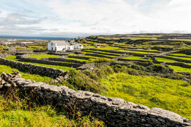 church among stone walls of small island town of ireland. - inisheer imagens e fotografias de stock