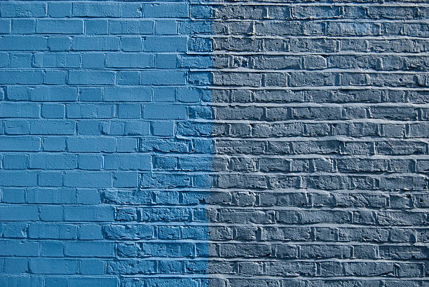 istock Two shades of blue paint on brick wall 147038780
