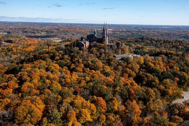 istock Church spires rise from fall colored trees in Wisconsin. 1470388473