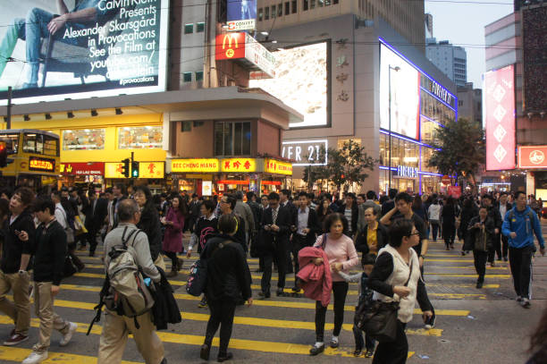 Central, Hong Kong,  03/08/2013:\nPedestrian crossing at a central intersection in Hong Kong