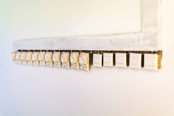 istock Traditional thermostat switches line the wall side by side 1470395493