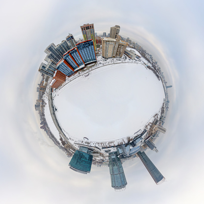 Aerial winter city view, Little planet sphere mode. Yekaterinburg city with Buildings of Parliament, Dramatic Theatre, Iset Tower, Yeltsin Center. Spherical panorama of the city. Yekaterinburg, Russia