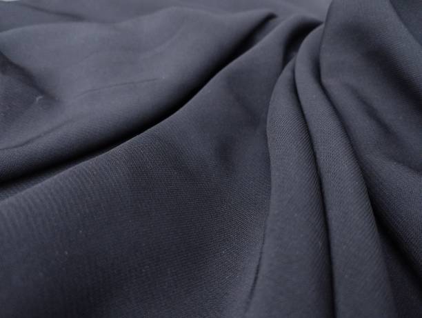 Fabric texture Soft black color viscose fabric texture seamless with beautiful closeup detail fabric. Luxury textile pattern with soft and delicate material, sometimes this fabric is called cornskin fabric. linen flax textile burlap stock pictures, royalty-free photos & images