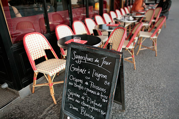 istock Menu stand placed outside on street at a cafe in Paris 147040222