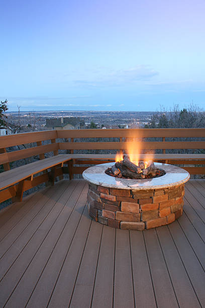 Fire pit on deck with bench seating stock photo