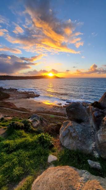 istock Rocks and sea at sunset 1470403476