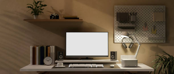 istock Modern home workstation with PC computer, gamer keyboard, speakers and decor on table 1470406924
