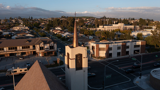 Sunset aerial view of a downtown church and surrounding city of Montebello, California, USA.