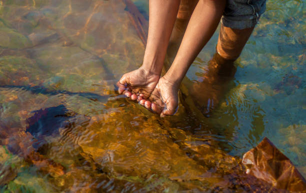 istock A man is playing in the water with his two hands 1470418750
