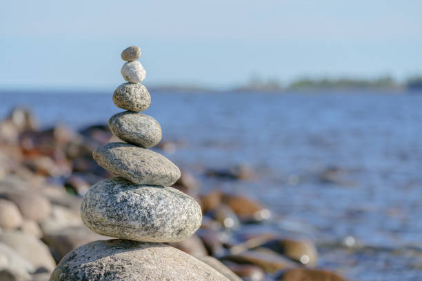 Pyramid of stones. Unstable balance of stone objects. Idyllic state of nature.
