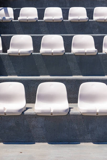 Rows of plastic seating in a stadium at a community baseball field