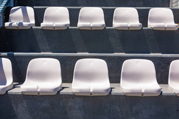 Rows of plastic seating in a stadium at a community baseball field