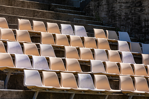 Rows of plastic seating in a stadium