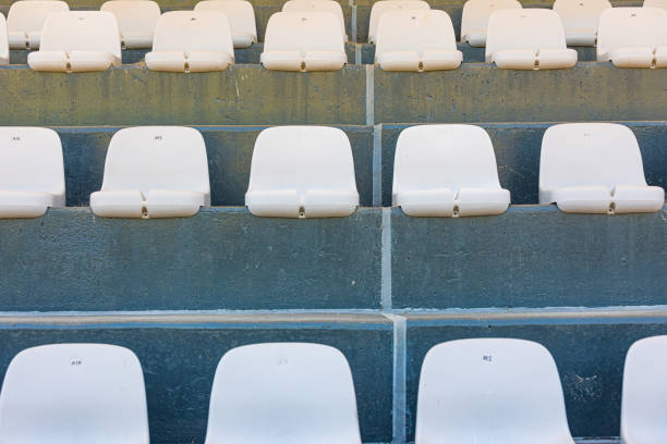 istock Rows of plastic seating in a stadium at a community baseball field 1470419624