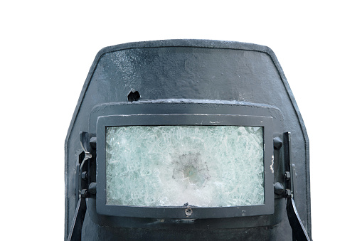 Demonstration of protective shields to protect police and special forces with bullet damage in bulletproof glass, isolated on a white background