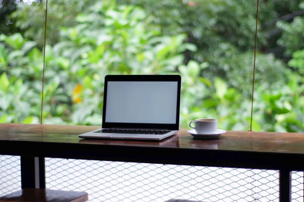 istock laptop with a white screen and a coffee 1470427149