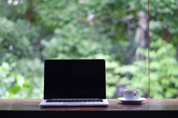 istock laptop with a white screen and a coffee 1470427160