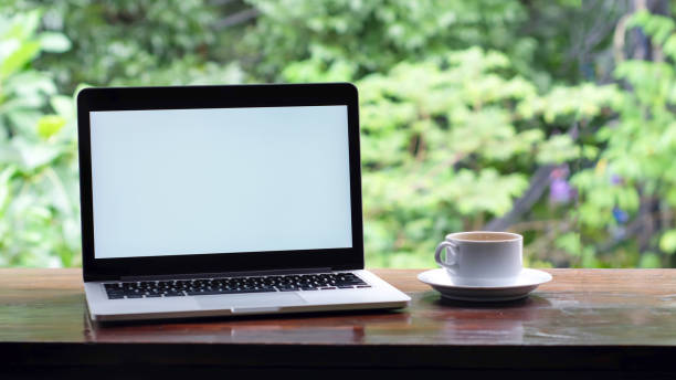 istock laptop with a white screen and a coffee 1470427218