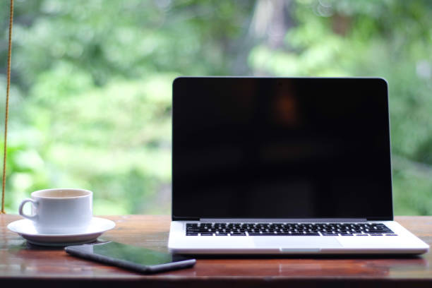 istock laptop with a white screen and a coffee 1470427414