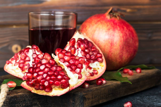 istock fresh juicy pomegranate on wooden table 1470428684