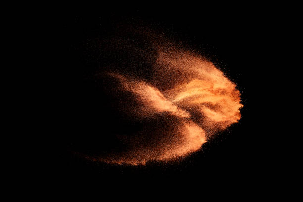 istock Brown colored sand splash.Dry river sand explosion isolated on black background. 1470428877