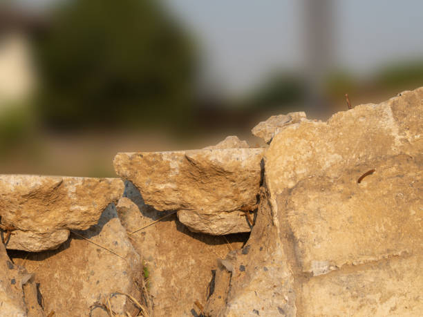 istock A pile of broken concrete with trees and sky as a backdrop 1470429317