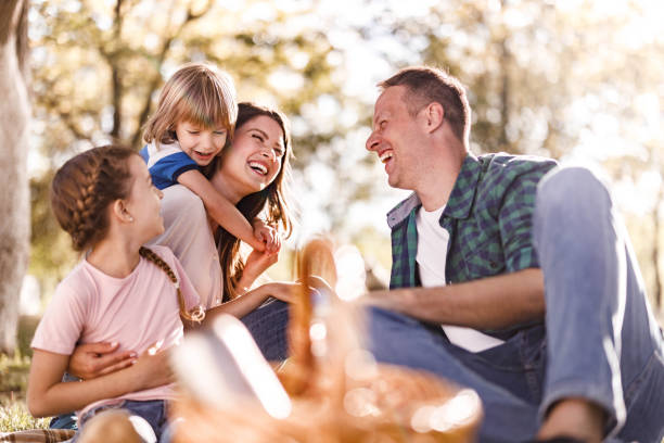 istock Cheerful family having fun on a picnic in spring day. 1470430079
