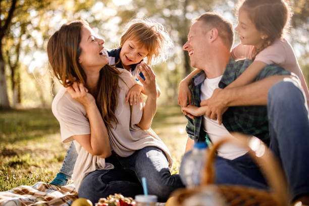 istock Cheerful family having fun on a picnic in spring day. 1470430164