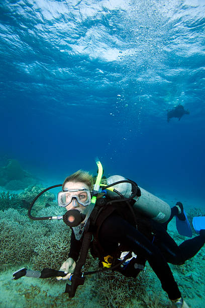 istock Woman scuba diving underwater 147043259