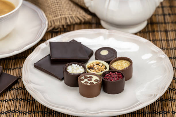 istock Porcelain coffee cup with delicious chocolate candies 1470434183