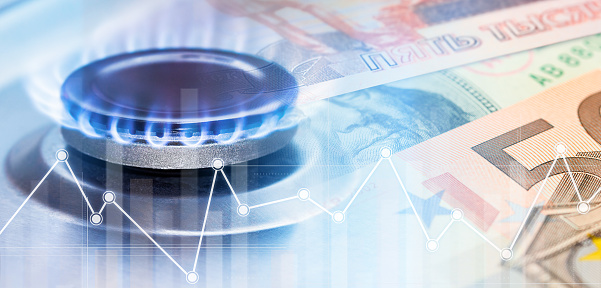 burning gas burner, charts and paper banknotes. double exposure, natural gas charges