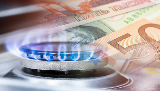 istock gas burner and paper banknotes 1470438496